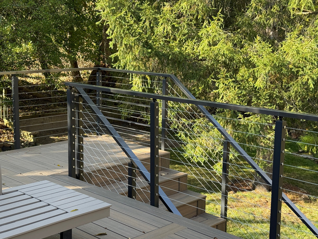 Black cable railing on composite deck stairs