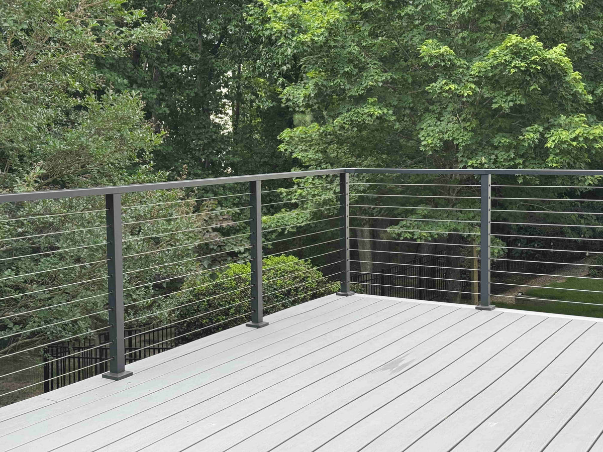 SENMIT surface-mounted matte black cable railing on a completed deck project in Cary, North Carolina.