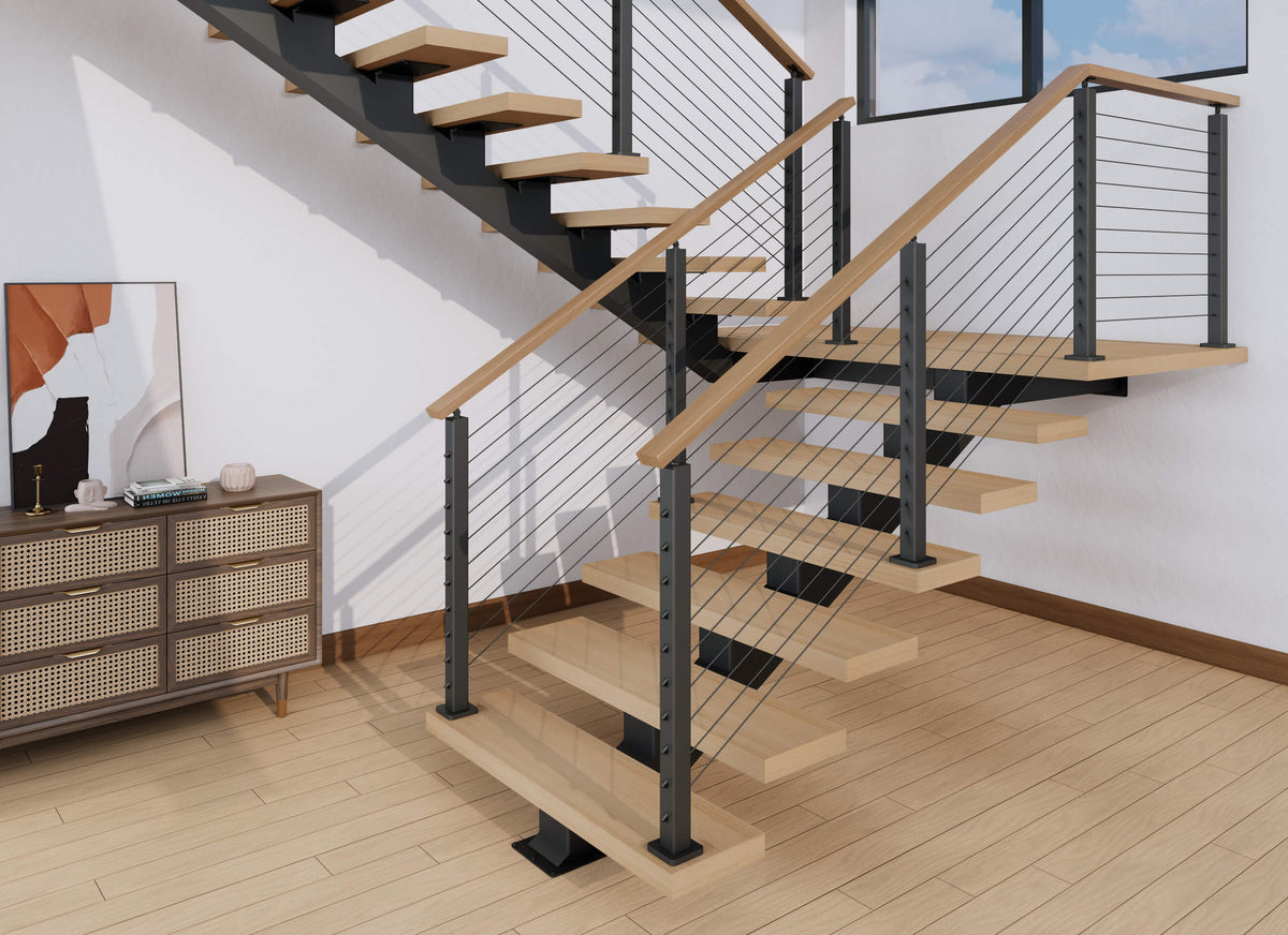 Black steel floating stair frame with wood treads, cable railing, and a wood handrail in a switchback layout